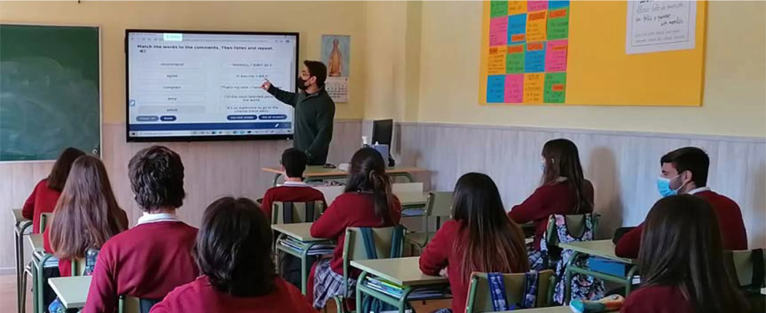 teacher using a Clevertouch IMPACT interactive display
