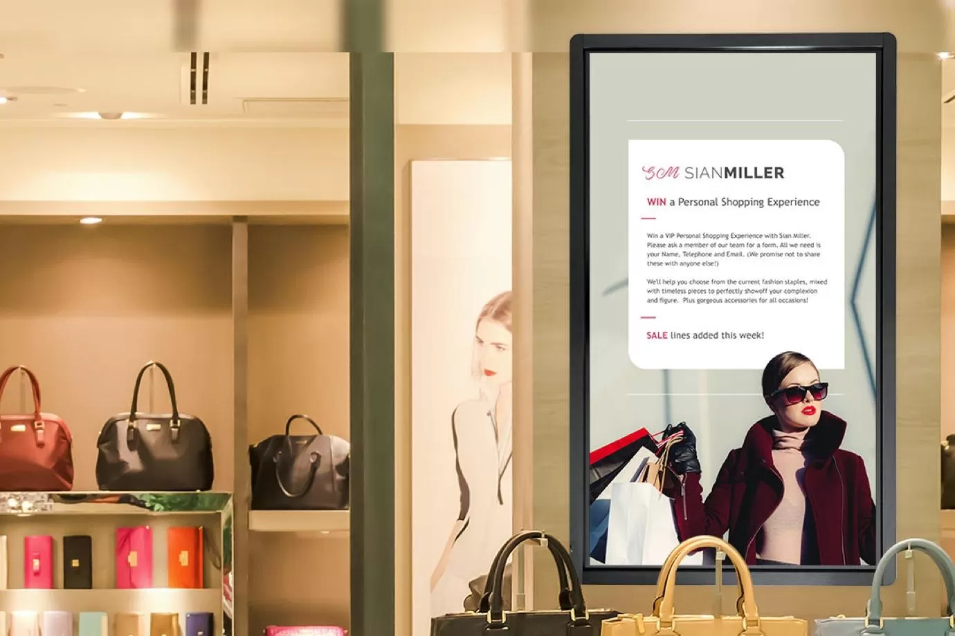 Clothes shop using digital signage to tell customers about a competition
