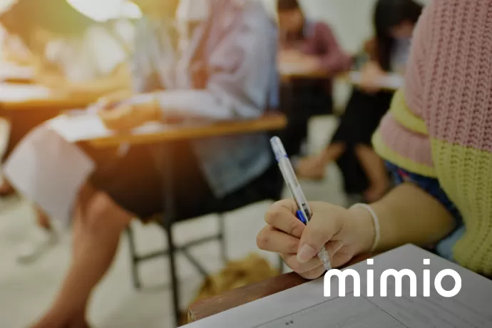 students writting at desks