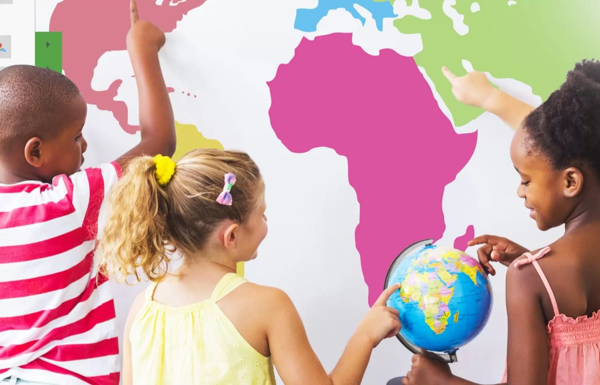 students looking at a globe and world map