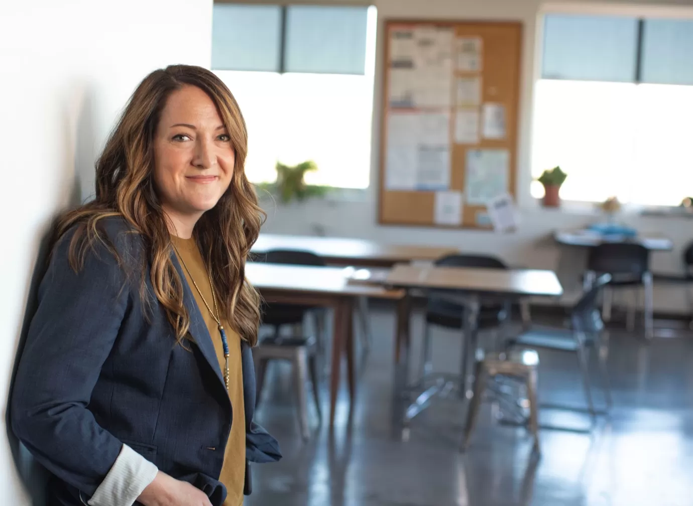 a person smiling in a classroom